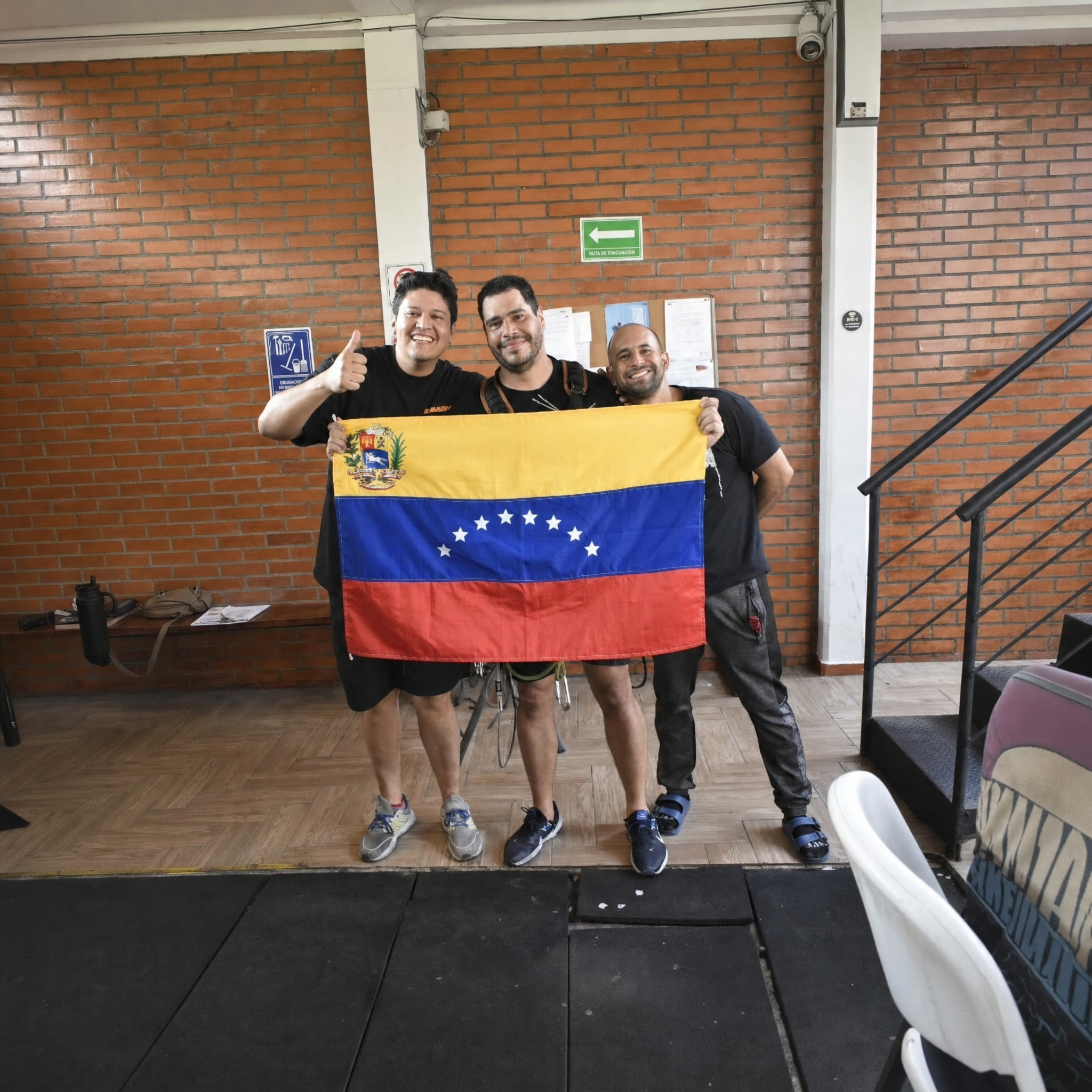 Participants holding the Venezuelan flag